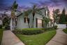 Neo-traditional architecture with classic charm and tropical Florida landscaping