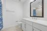 Third-level bathroom with a clean, modern design.