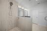 Third-level primary bathrooms beautifully designed, spacious walk-in shower