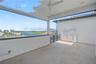 Fourth-level private patio offering a front-row seat for possible dolphin sightings.