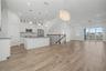 Second-level kitchen/dining  opening seamlessly to the living area.