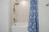 Third-level bathroom featuring a convenient tub/shower combination.