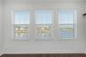 Third-level primary bedroom offering  beautiful water views.