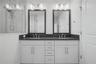 Third-level, master bath with double sinks.