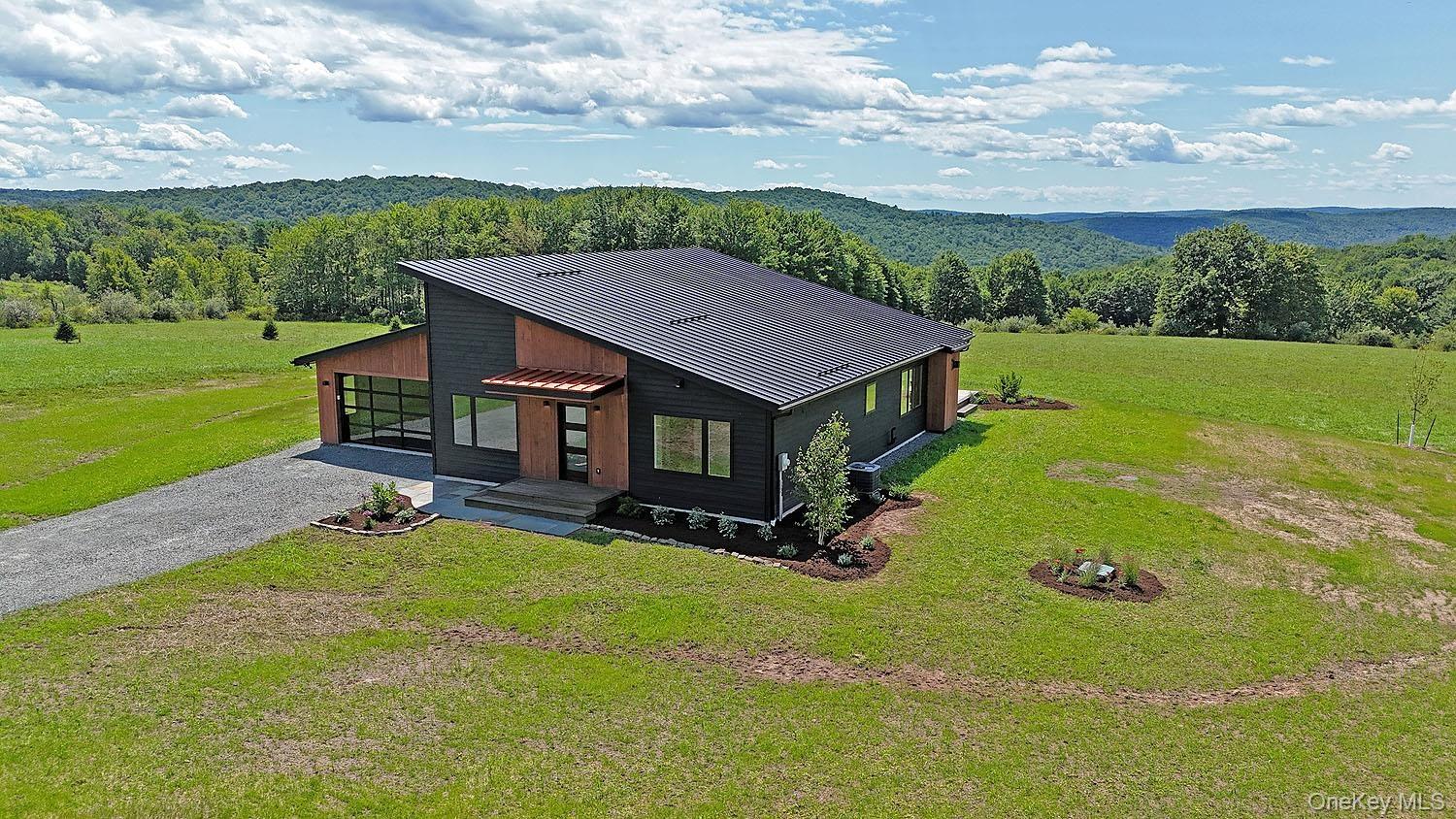 199 Henderson Rd. Set on 12+ acres with tremendous long-range views!