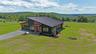 199 Henderson Rd. Set on 12+ acres with tremendous long-range views!