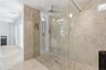 Step-in shower with multiple shower heads