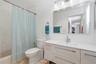 2nd floor bathroom has bathtub with shower