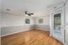 Primary bedroom with screened balcony