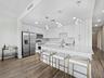 Large kitchen island with quartz counters