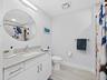 2nd full guest bath with tile floors & upgraded lighting