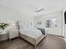Spacious primary bedroom with plenty of natural light and room for king bed