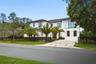 Ample driveway to park up to 9 cars in both sides plus an air conditioning garage for 3 additional car and space for a car lift.