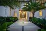 Front Entrance with Elegant Oversized Teak Wood Door