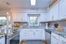 Crisp white cabinetry creates a clean, timeless appearance