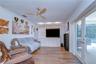 Comfortable gathering space connects seamlessly with the kitchen and casual dining area
