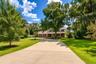 Spacious circular driveway provides abundant parking and an impressive arrival