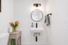 Beautifully remodeled half bath adds a fresh, updated touch to the main level