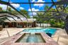 Beautiful cascading spa adds a resort-style element to the backyard