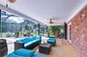 Expansive screened lanai creates an exceptional outdoor living and entertaining area