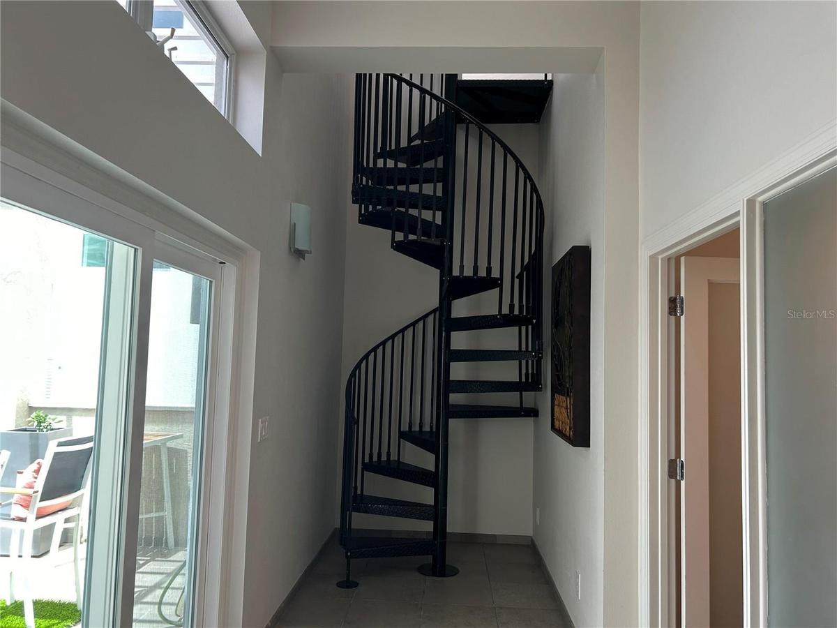 hallway to 2nd floor 3rd guest bedroom and main floor