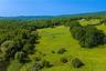 Pastures, several run-ins, and a pond in the lower left corner.