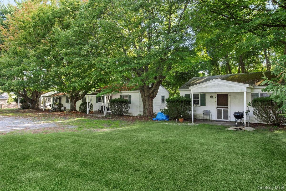Eastern side view of Cottages 1-4 on 1.16acre