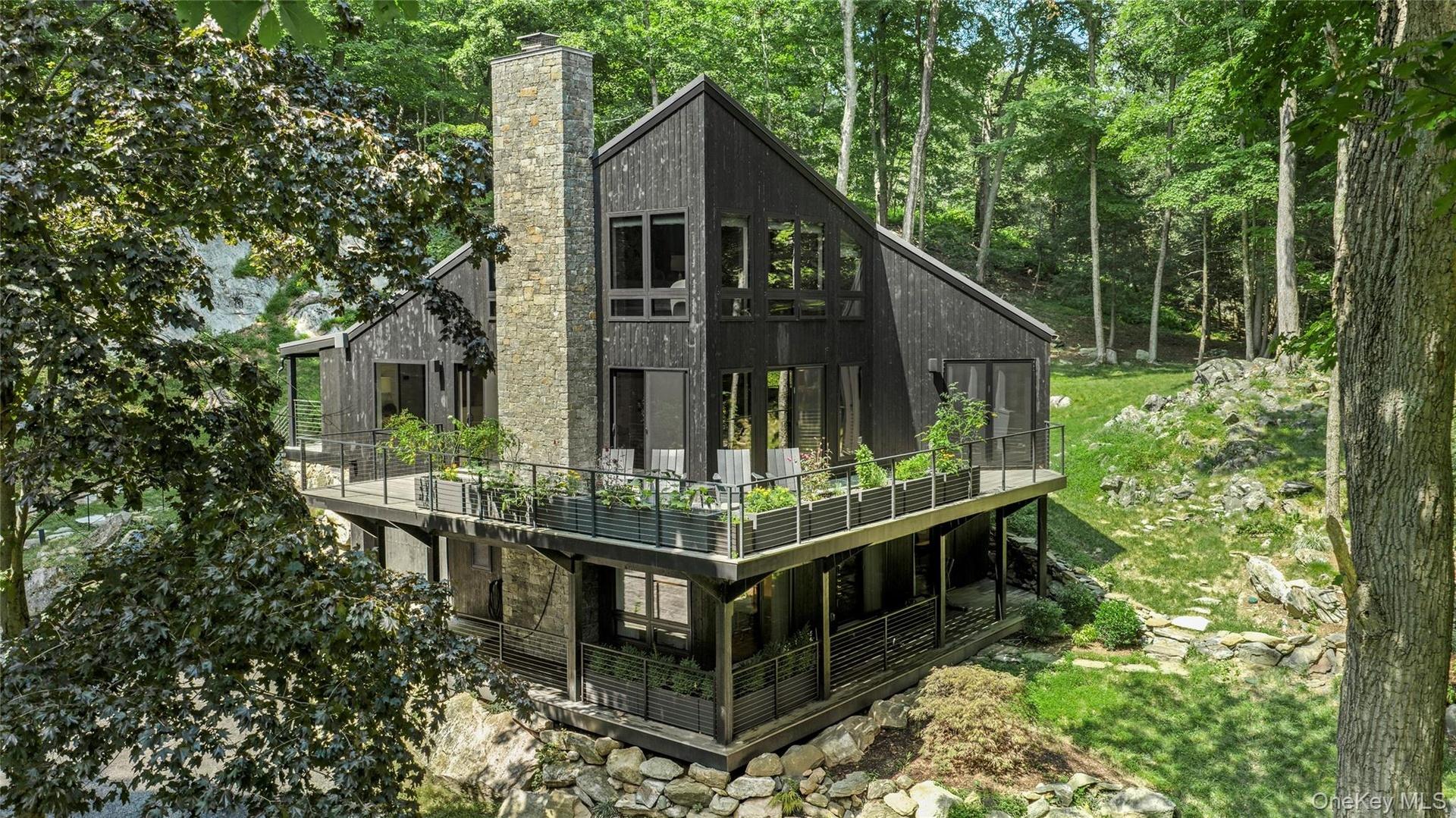 A striking modern woodland retreat, completely rebuilt in 2023 and surrounded by the natural beauty of Sedgewood.