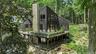 A striking modern woodland retreat, completely rebuilt in 2023 and surrounded by the natural beauty of Sedgewood.