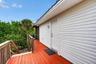 Back deck and stairway leading to back door and faces west