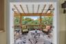French doors leading out to the screened in porch