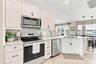 New cabinets, tops and appliances