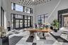 Grand entry featuring double glass doors and a high ceiling