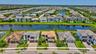 Aerial perspective showcasing a residential community with water features