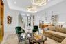 Open-concept living space with high ceilings and recessed lighting