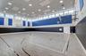 Indoor sports court with wood-finish flooring and court markings