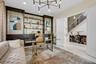 Dedicated office space featuring custom built-in shelving with integrated cabinetry