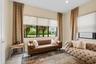 Living area featuring large windows with roller shades, recessed lighting, and tile flooring