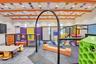Vibrant indoor recreational space featuring soft play structures and padded flooring