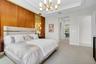 Accent wall with wood paneling and decorative gold-toned screening