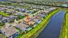 Aerial perspective showcasing a residential community with water features