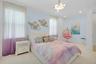 Bedroom featuring light blue walls, two large windows with sheer and purple ombre curtains, recessed lighting, and a contemporary chandelier