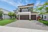 Contemporary architectural facade featuring stacked stone accents and a flat roofline