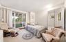 Bedroom w/ balcony access