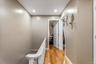 The upstairs level includes four bedrooms, offering plenty of space and privacy for family members or guests. Each room connects to the bright hallway
