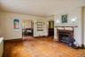 Living Room with wood burning fireplace and hardwood floors