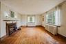 Living Room with wood burning fireplace and hardwood floors