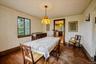 Dining room off living room with hardwood floors leading into Kitchen