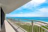 The covered oceanfront balcony opens to wide Atlantic Ocean and Singer Island beach views from this 15th-floor residence.
