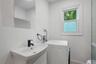 Main bathroom with washer/dryer combo unit